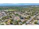 Expansive aerial view of the neighborhood and distant cityscape with trees at 1159 19Th Sw Ave, Largo, FL 33778