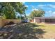 Fenced backyard with a shed, wood pile, and room to play at 1159 19Th Sw Ave, Largo, FL 33778