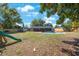 Large backyard featuring an in-ground pool, and lush greenery, creating a serene and private retreat at 1159 19Th Sw Ave, Largo, FL 33778
