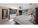 Comfortable bedroom with a ceiling fan and two windows providing natural light at 1159 19Th Sw Ave, Largo, FL 33778