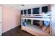Inviting bedroom showcasing a comfortable bunk bed and a stylish accent wall at 1159 19Th Sw Ave, Largo, FL 33778