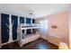 Bedroom with bunk beds, unique accent wall, and light pink walls at 1159 19Th Sw Ave, Largo, FL 33778