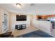 Open-concept living area with modern tile flooring and seamless flow to the kitchen at 1159 19Th Sw Ave, Largo, FL 33778