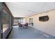 Large covered patio with dining set and view of the fenced backyard at 1159 19Th Sw Ave, Largo, FL 33778
