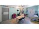 Playroom featuring a table and chairs, storage shelves, and a bright blue color scheme at 1159 19Th Sw Ave, Largo, FL 33778