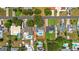 Aerial view of the property highlighting pool, landscaping, roof, and neighborhood at 12453 138Th N St, Largo, FL 33774