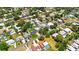 Aerial view showing neighborhood homes, landscaping, and pool locations at 12453 138Th N St, Largo, FL 33774