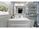 Bathroom vanity with white sink, modern fixtures, and ample lighting at 12453 138Th N St, Largo, FL 33774