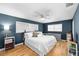 Bedroom boasts natural light, a comfortable bed, modern decor, and hardwood floors at 12453 138Th N St, Largo, FL 33774