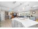 Modern kitchen featuring white cabinetry, stainless steel appliances, ample counter space, and an open design at 12453 138Th N St, Largo, FL 33774