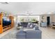 Spacious living room featuring a comfortable sectional sofa, neutral color palette, and bright, open layout at 12453 138Th N St, Largo, FL 33774