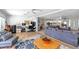 Inviting living room featuring hardwood floors, a comfortable sitting area, and a dedicated workspace at 12453 138Th N St, Largo, FL 33774