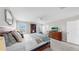 Spacious bedroom featuring a bed, dresser, and a bright window at 12724 Tannencrest Dr, Riverview, FL 33579