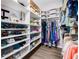 Organized walk-in closet featuring custom shelving and ample hanging space at 1281 Pine Ridge E Cir # H1, Tarpon Springs, FL 34688