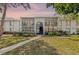 Charming two-story condo featuring a beautifully landscaped lawn and screened-in balconies at 1281 Pine Ridge E Cir # H1, Tarpon Springs, FL 34688