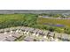 Beautiful aerial view of a suburban neighborhood, showcasing lush greenery and well-maintained homes at 13357 Waterleaf Garden Cir, Riverview, FL 33579