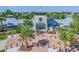 Close up of community clubhouse entrance with holiday decorations and manicured landscaping at 13357 Waterleaf Garden Cir, Riverview, FL 33579