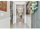 Inviting hallway featuring neutral tones, decorative wainscoting and decor at 13357 Waterleaf Garden Cir, Riverview, FL 33579