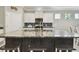 Stylish kitchen with large island, granite countertops, and modern appliances, ideal for entertaining at 13357 Waterleaf Garden Cir, Riverview, FL 33579