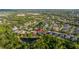 An aerial view of a residential area featuring houses, ponds, green spaces, and lush vegetation at 14019 Nighthawk Ter, Lakewood Ranch, FL 34202