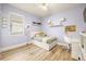 Cozy bedroom with light purple walls, modern decor and a large window at 14019 Nighthawk Ter, Lakewood Ranch, FL 34202