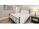 Bedroom with ski decor, hardwood floors, and a metal bed frame at 14019 Nighthawk Ter, Lakewood Ranch, FL 34202