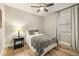 Bedroom with a ceiling fan and hardwood floors at 14019 Nighthawk Ter, Lakewood Ranch, FL 34202