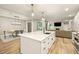 Open concept kitchen with large island and breakfast bar at 14019 Nighthawk Ter, Lakewood Ranch, FL 34202