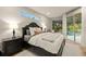 Serene main bedroom with a view of the pool area at 14019 Nighthawk Ter, Lakewood Ranch, FL 34202