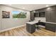 Spacious office with custom built-ins, ample storage, and large window for natural light at 14019 Nighthawk Ter, Lakewood Ranch, FL 34202