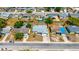Overhead view of house featuring roof and nearby neighborhood with cars parked on the side of the road at 1408 Dartmouth Dr, Holiday, FL 34691