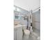 Cozy bathroom featuring a tiled shower with a shower curtain and a white vanity at 1408 Dartmouth Dr, Holiday, FL 34691
