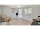 Clean bedroom with light wood floors and neutral gray walls at 1408 Dartmouth Dr, Holiday, FL 34691