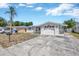 Charming single-story home with a well-maintained front yard and a single car garage at 1408 Dartmouth Dr, Holiday, FL 34691