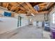 Spacious garage with laundry machines, utility sink, and exposed wood rafters at 1408 Dartmouth Dr, Holiday, FL 34691