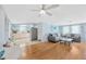 Open living room and kitchen area featuring hardwood floors and stainless steel appliances at 1408 Dartmouth Dr, Holiday, FL 34691