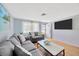 Bright living room with hardwood floors and modern decor at 1408 Dartmouth Dr, Holiday, FL 34691