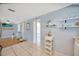 Bright living room with tiled floors and modern decor at 1408 Dartmouth Dr, Holiday, FL 34691