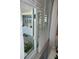 View of screened porch area highlighting sliding glass doors leading to the interior at 1408 Dartmouth Dr, Holiday, FL 34691