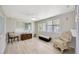 Cozy sitting room featuring hardwood floors, natural lighting, and comfortable seating at 1408 Dartmouth Dr, Holiday, FL 34691