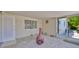 Neutral sun room with outdoor views and neutral flooring at 1408 Dartmouth Dr, Holiday, FL 34691