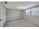 Bedroom with large window and plush gray carpeting at 1516 Roundtree Rd, Holiday, FL 34690