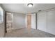 Bedroom with plush carpeting and easy access to bathroom and hallway at 1516 Roundtree Rd, Holiday, FL 34690