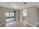 Dining room featuring sliding glass doors to a screened lanai, connected to the kitchen at 1516 Roundtree Rd, Holiday, FL 34690