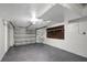 Spacious garage with epoxy flooring, ample storage, and a modern garage door at 1516 Roundtree Rd, Holiday, FL 34690