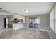 Open kitchen and dining area with stainless steel refrigerator and breakfast bar at 1516 Roundtree Rd, Holiday, FL 34690