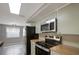 Updated kitchen with modern stainless-steel appliances, wood countertops and neutral toned cabinetry at 1516 Roundtree Rd, Holiday, FL 34690