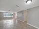 Open living area with new floors, neutral paint, and a bright and airy feel at 1516 Roundtree Rd, Holiday, FL 34690