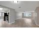 Bright living room featuring neutral paint, tile floors, and plenty of natural light at 1516 Roundtree Rd, Holiday, FL 34690