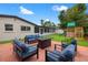 Backyard showcasing outdoor seating, a playground, and well-maintained landscaping at 1529 79Th N Ave, St Petersburg, FL 33702
